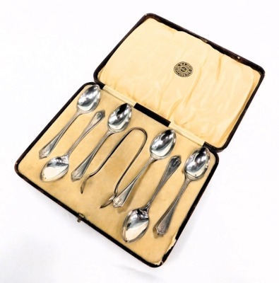 A George V silver spoon and tong set, comprising six teaspoons and set of sugar tongs, each with a tulip bow drop, maker LNS, Birmingham 1926, 2.04oz, in WE Gray of Oxford Street presentation box. - 2