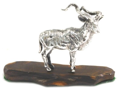 A 20thC white metal figure modelled of an antelope by Patrick Mavros, stamped to underside 701, 7.5cm high, 4.36oz, on a hardwood base.