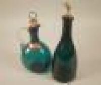 A Victorian green glass mallet shaped claret jug and stopper