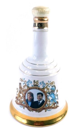 A Bell's porcelain commemorative whisky decanter, for the marriage of Prince Andrew with Sarah Ferguson 1986, with contents.