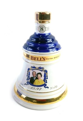 A Bell's 50th golden anniversary porcelain whisky decanter, aged eight years, boxed, with contents.