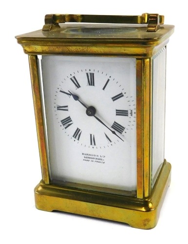 A late 19th/early 20thC French brass carriage timepiece, the dial stamped Harrod's Limited London, Paris, made in France, 15cm high.