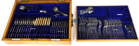 A part silver plated fiddle pattern canteen of cutlery, the oak case labelled for Goldsmiths and Silversmiths Company Limited Regent Street London.