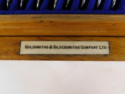 A part silver plated fiddle pattern canteen of cutlery, the oak case labelled for Goldsmiths and Silversmiths Company Limited Regent Street London. - 3