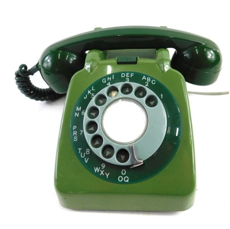 A vintage two tone green vintage telephone, 24cm wide.