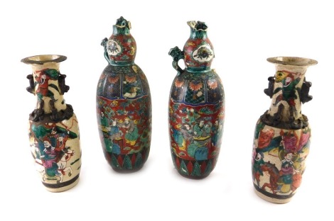 A pair of Chinese famille verte vases, each decorated with warriors on a crackle ground, and a pair of Oriental two handled vases (AF). (4)