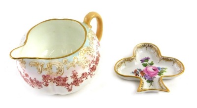 A Doulton Burslem milk jug, decorated with bands of flowers, and a small Dresden shaped dish painted with flowers. (2)