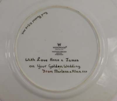 A Wedgwood Traditions Heirloom porcelain plate, later decorated with flowers and leaves within gilt borders, by D Hirst in 2005, with personal inscription, 29cm diameter. - 2