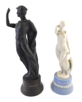 A Wedgwood blue and white Jasperware figure of a Leda and the swan, boxed, 26cm high, and a black basalt figure of Mercury, boxed, (AF), 30cm high. (2)