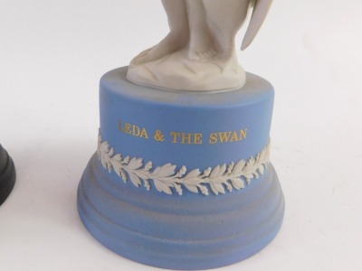 A Wedgwood blue and white Jasperware figure of a Leda and the swan, boxed, 26cm high, and a black basalt figure of Mercury, boxed, (AF), 30cm high. (2) - 3