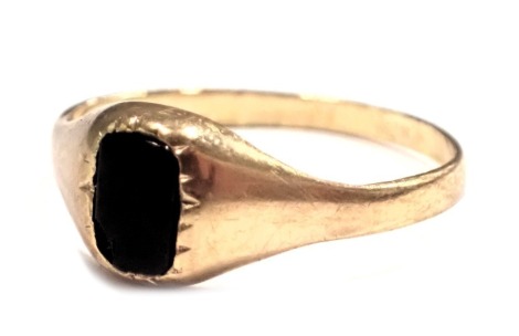 A 9ct gold signet ring, the rectangular black onyx panel in a rub over setting, on yellow metal band, ring size M, 1.4g all in.