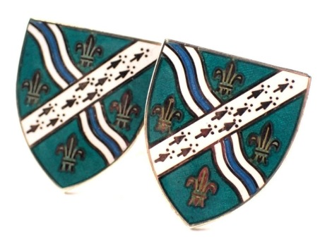 A pair of Thomas Fattorini silver and enamel cufflinks, each shaped as a shield, with turquoise, white and blue enamel decoration, on bar backs, 13.7g all in, boxed.