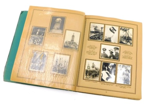 An album containing Third Reich cigarette cards, varying subject matters, to include military processions, Adolf Hitler signing documentation, planes, street scenes, machinists working on Third Reich flags, etc.