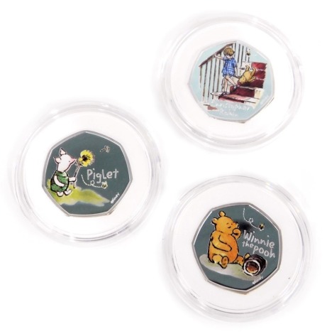 Three Royal Mint Disney classic Pooh fifty pence silver proof coins, comprising 2020 Piglet, 2020 Christopher Robin, and 2020 Winnie the Pooh, boxed. (3)