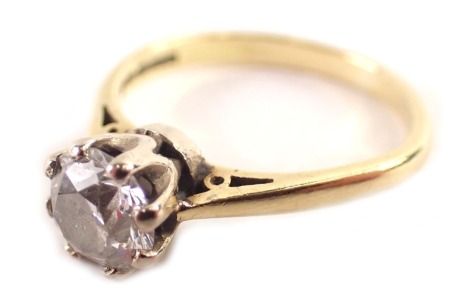 An 18ct gold solitaire ring, set with a round brilliant cut diamond, in eight claw setting, ring size J½, 3g all in.