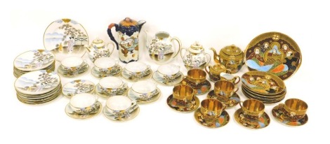 A Japanese egg shell porcelain part tea service, Satsuma type service decorated with seated figures in raised enamels and gilt interiors, etc.