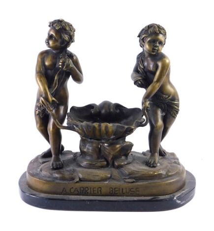 After Carrier Bellose. A bronzed metal sculpture of two figures beside a clam shell, on a shaped marble base, 31cm wide.