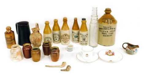 A quantity of stoneware bottles, commemorative cups, saucers, etc.