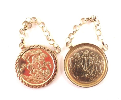 Two Saint George pendant drops, each set with imitation half sovereign front with George slaying dragon, in a hammered border, on yellow metal links, unmarked, believed to be gold plated. (2)