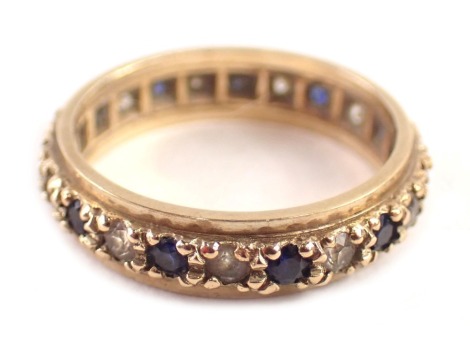 A 9ct gold eternity ring, set with sapphire and diamonds, each in claw setting, ring size L, 2.7g all in.