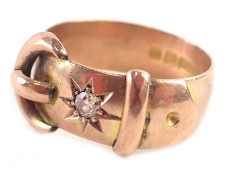 A George V 9ct gold buckle ring, set with old cut diamond in claw setting, approximately 0.10ct on rose gold band, maker HW Limited, Birmingham 1915, ring size R, 5.6g all in.