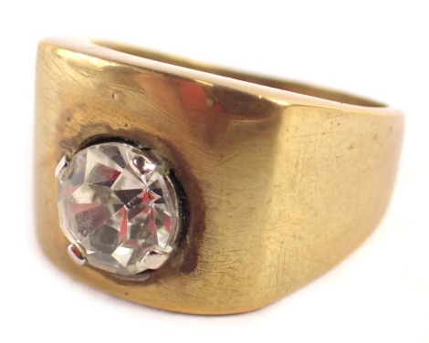 A signet ring, set with imitation diamond in four claw setting, of plain brass design, ring size S½, boxed.