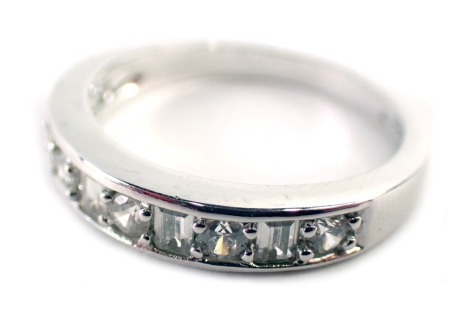 A Norwegian CZ half hoop dress ring, set with arrangement of baguette and round brilliant cut CZs, on a white metal setting, with rubbed markings, ring size P½, 2.8g all in.