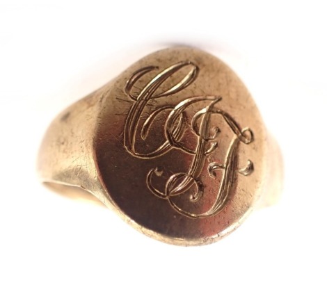 A 9ct gold signet ring, the oval ring head bearing the initials C.J.F, maker CMJ, Birmingham 1961, ring size V½, 4.7g.