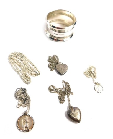 A group of silver and other jewellery, comprising Queen Elizabeth II patterned napkin ring, various white metal pendants and chains, some stamped 925, some stamped silver, 43.3g all in. (a quantity)