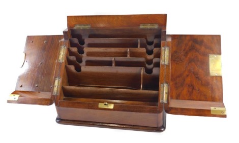 A Victorian walnut writing box, the slope top enclosing a fitted interior, etc., 30cm wide.