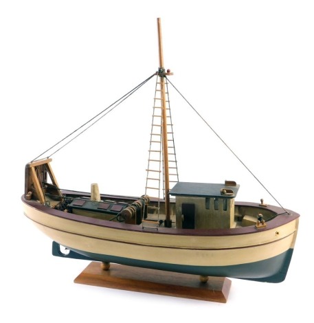 A scale model of a fishing boat in maroon and cream, on rectangular base, 54cm long.