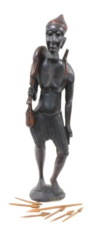 A large African tribal figure, of a huntsman with antelope, etc., 102cm high.