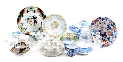 A collection of ceramics and glass, to include an ironstone plate, a 19thC porcelain egg cruet in white with gilt borders, decorative cups, saucers, cut glass jar and cover, tureen, etc.