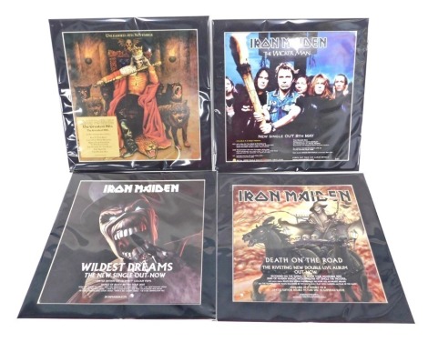 Four original Iron Maiden shop window posters, image size 30cm x 30cm, mounted.