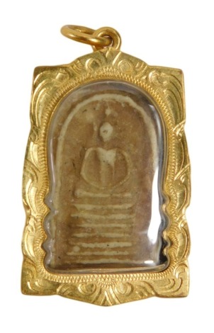 An Eastern inspired memorial pendant, the central panel set with carved plaster moulding of skeleton on plinth, with a raised moulded plastic cover, in a yellow metal frame, unmarked, 4cm x 3cm, 16g all in.