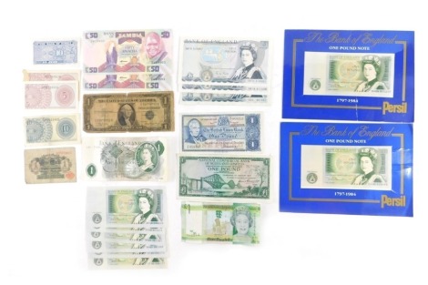 A collection of UK banknotes, comprising Personal Presentation one pound notes 1984, seven loose one pound notes, two Bank of England five pound notes, a State of Jersey one pound note, Zambian banknotes, etc.