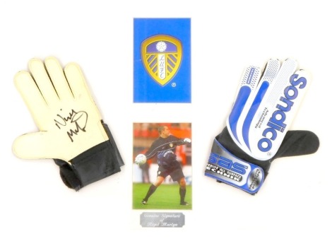 A Nigel Martyn framed print, of the Leeds United goal keeper and gloves, bearing signature with a Penco of Peterborough certificate of authenticity, dated 24.05.02, in modern pine frame, 39cm x 53.5cm.