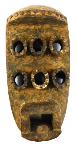 A Grebo (Krou) Maou six eyed warrior mask with metal studs, Liberia, 38cm high.