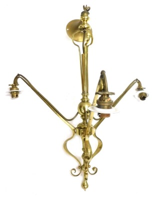 An early 20thC Art Nouveau brass three branch chandelier, with white finish shades, 58cm high.