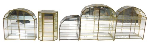 Five glass and gilded sectional display cases.