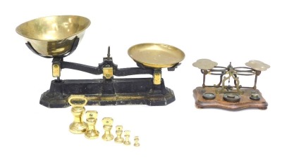 Brassware, comprising a set of 19thC metal and brass tabletop scales, and a set of Sovereign scales and weights, 29cm and 13cm high. (2)