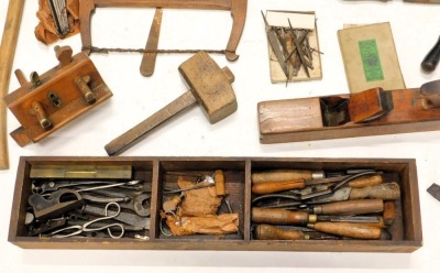 A 19thC black painted pine ships carpenter's tool chest and contents, to include wood block planes, a miniature plane, chisels, screwdrivers, saws, etc., 33cm high, 87cm wide, 40cm deep. - 2