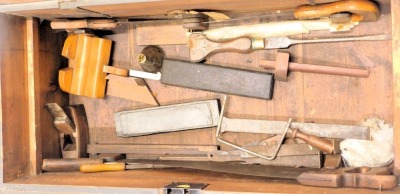 A 19thC black painted pine ships carpenter's tool chest and contents, to include wood block planes, a miniature plane, chisels, screwdrivers, saws, etc., 33cm high, 87cm wide, 40cm deep. - 3