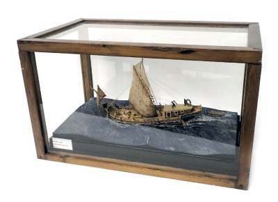 A diorama and scale model of a Roman merchant ship, in stained pine and perspex case, 85cm wide.