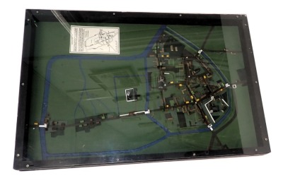 A scale model of Medieval Doncaster, showing buildings and surrounding fields, waterways, etc., in perspex case, 92cm x 63cm.