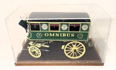 A scale model of a horse drawn omnibus coach, in black, green and yellow livery, 1cm:12cm, in perspex and wooden case, 54cm wide. - 2