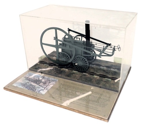 A scale model of Richard Trevithick's Tramroad locomotive, scale 1cm:12cm, seated on a track with informative display, within wood and perspex case, 43cm wide.