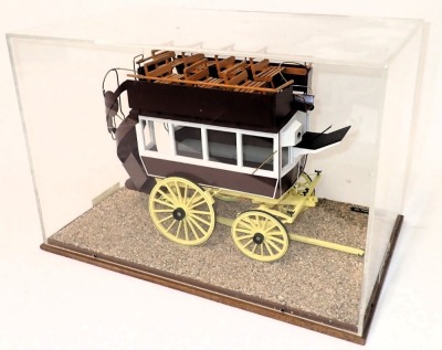 A model of an early 20thC horse omnibus or carriage, in orange, maroon, white and yellow livery, within a wood and perspex case, 51cm wide. - 2