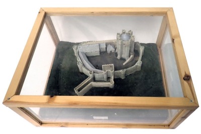 A diorama model of Conisbrough Castle, with landscaping, in wood and perspex case, 68cm wide.