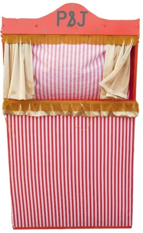 A red painted Punch & Judy booth or stage, with a striped fabric, 91cm wide.